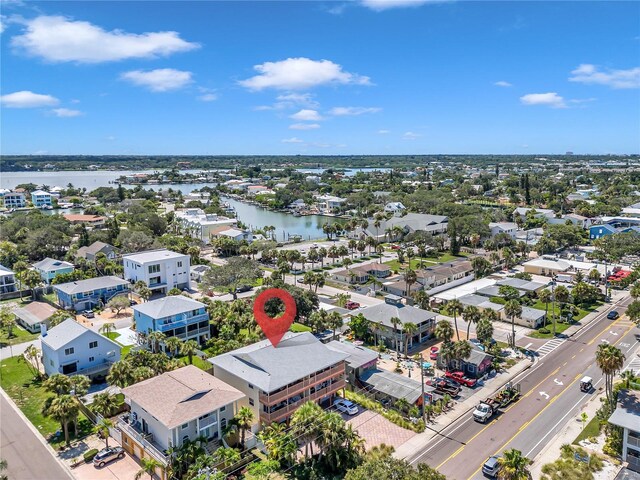 drone / aerial view with a water view and a residential view