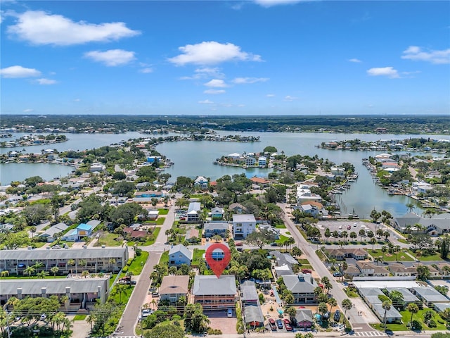 drone / aerial view with a residential view and a water view