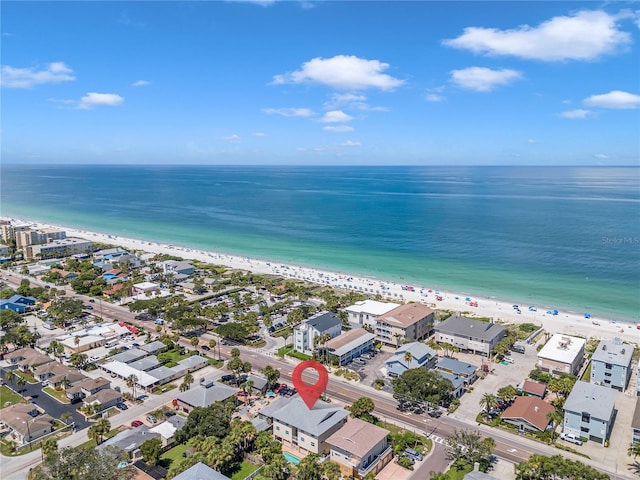 bird's eye view with a water view and a beach view