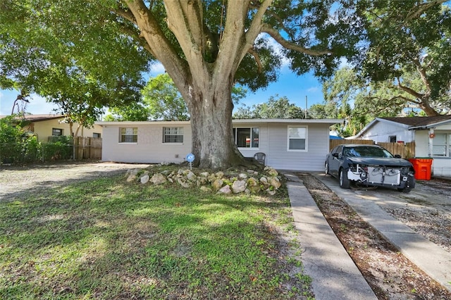 single story home with fence