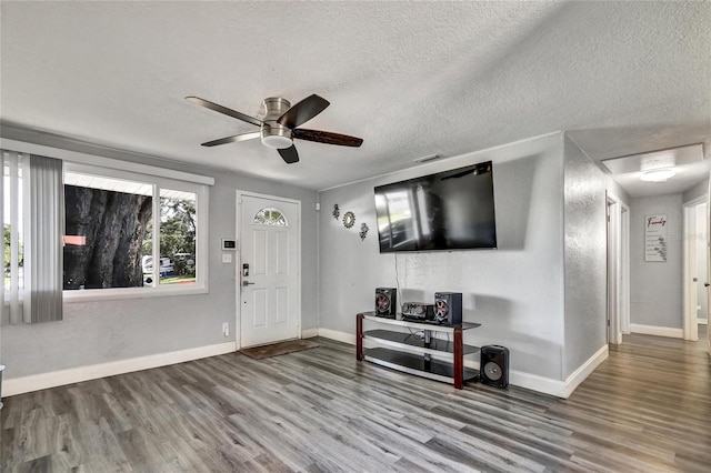 foyer featuring a textured ceiling, ceiling fan, and hardwood / wood-style floors