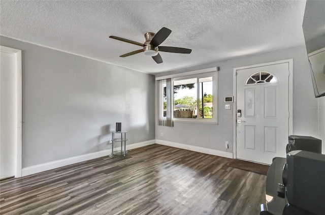 entryway with hardwood / wood-style flooring, a textured ceiling, and ceiling fan