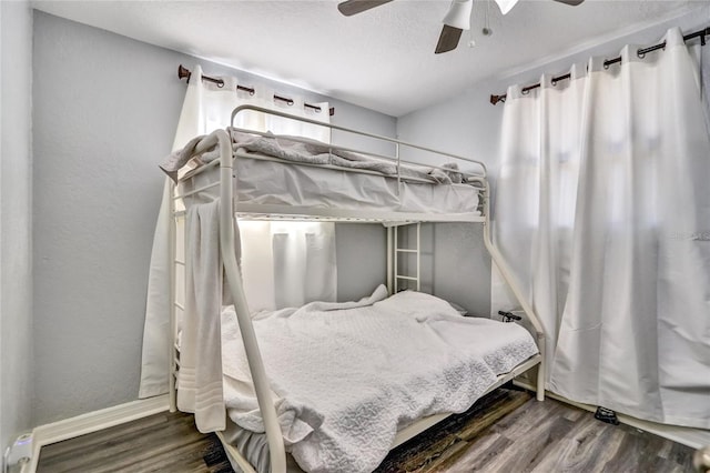 bedroom featuring ceiling fan and hardwood / wood-style flooring