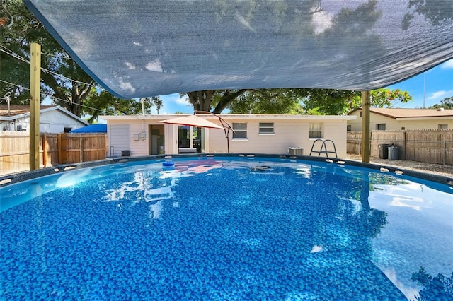 view of swimming pool with a fenced backyard and a fenced in pool