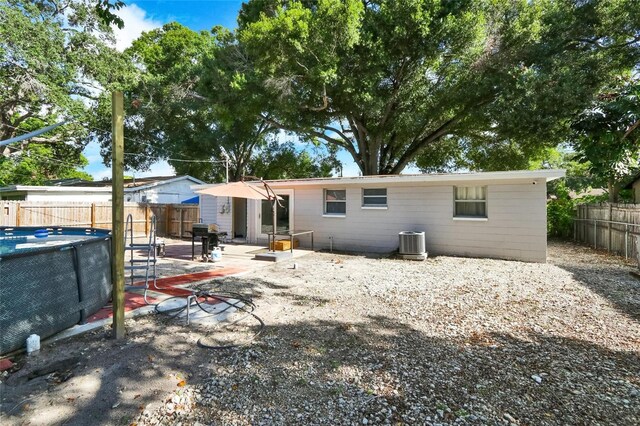 back of house featuring central AC and a patio area