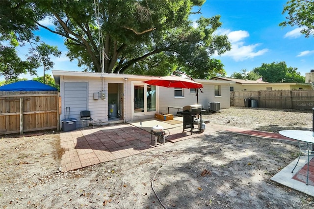 back of property with a patio area, fence, and cooling unit