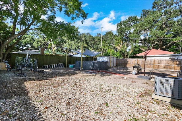 view of yard with a fenced backyard and a fenced in pool