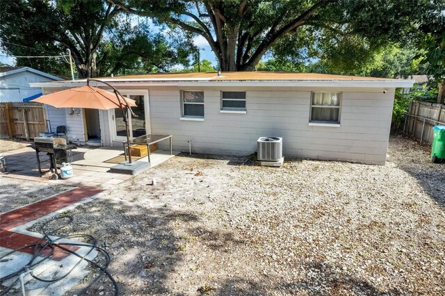 rear view of property featuring central AC and a patio