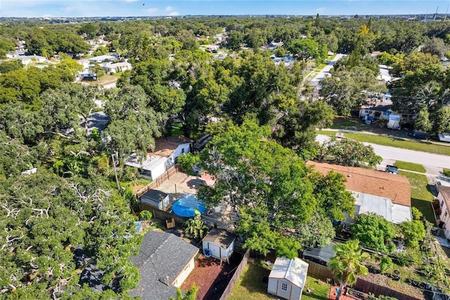 birds eye view of property with a forest view