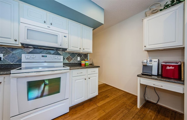 kitchen with white cabinetry, wood-type flooring, white appliances, and backsplash