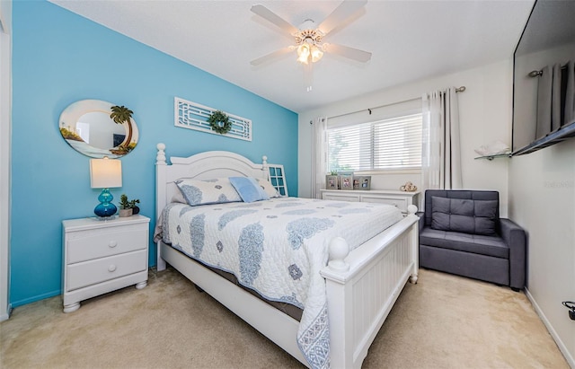 bedroom featuring light colored carpet and ceiling fan