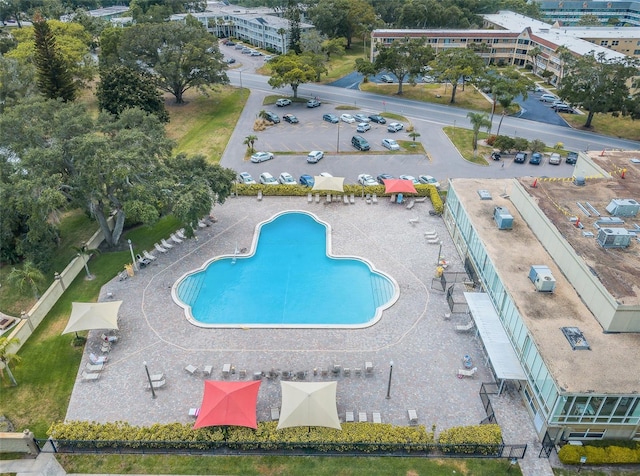 view of swimming pool with a patio area and cooling unit