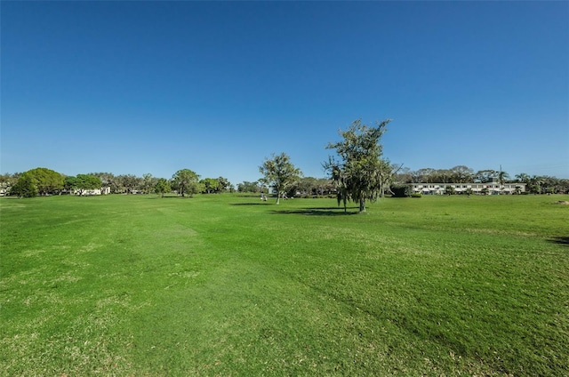 view of home's community featuring a lawn