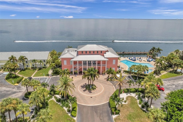 birds eye view of property with a water view