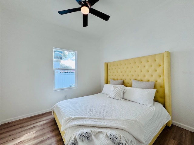 bedroom with ceiling fan and wood-type flooring