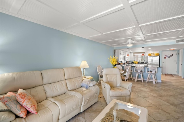 living room with visible vents, ceiling fan, and light tile patterned floors