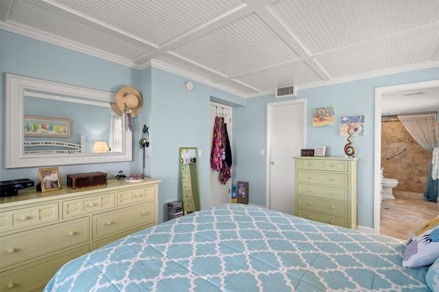 bedroom with a closet, connected bathroom, and visible vents