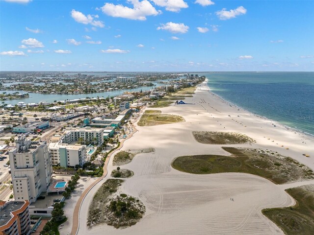 birds eye view of property with a water view, a view of the beach, and a city view