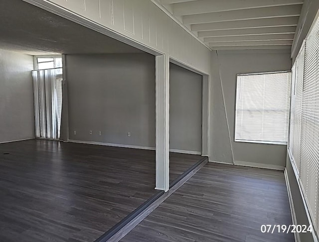 535 Monterey Blvd NE, Saint Petersburg, FL 33704 - unfurnished room with dark hardwood / wood-style flooring and beam ceiling