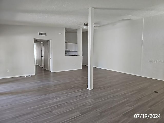 535 Monterey Blvd NE, Saint Petersburg, FL 33704 - interior space featuring a textured ceiling, dark wood-type flooring, and ceiling fan