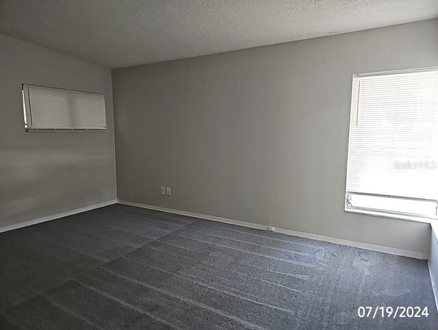 535 Monterey Blvd NE, Saint Petersburg, FL 33704 - empty room featuring a textured ceiling