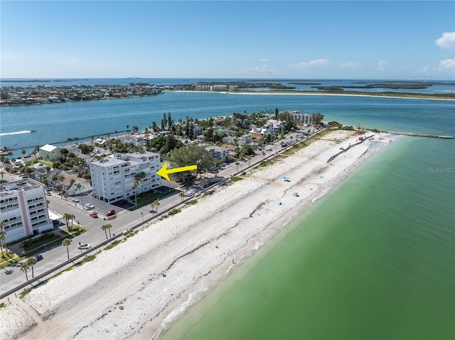 birds eye view of property with a beach view and a water view