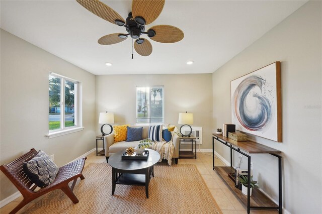 sitting room with light tile patterned flooring and ceiling fan