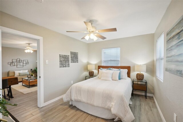 bedroom featuring ceiling fan and light wood-type flooring