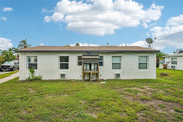 back of property featuring a yard