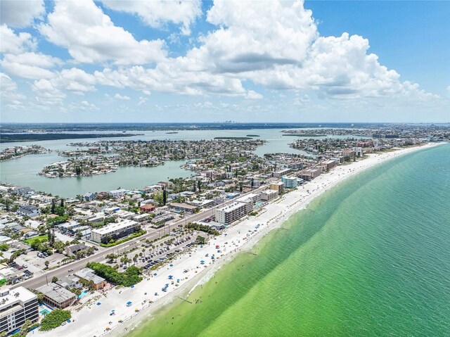 bird's eye view featuring a view of the beach and a water view