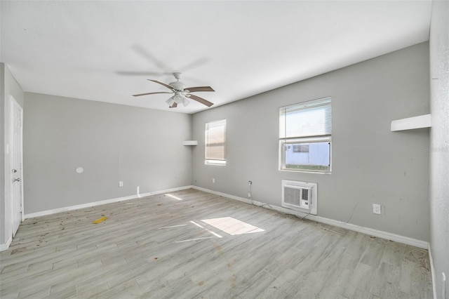 unfurnished room featuring ceiling fan, a wall mounted air conditioner, and light hardwood / wood-style floors