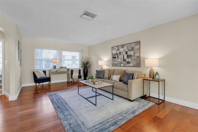 living room featuring dark hardwood / wood-style flooring