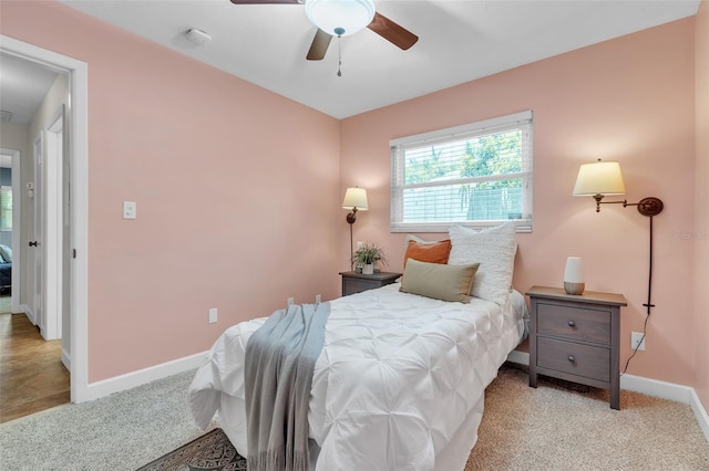 carpeted bedroom featuring ceiling fan