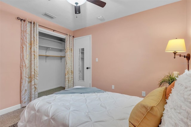 bedroom with a closet, ceiling fan, and carpet flooring