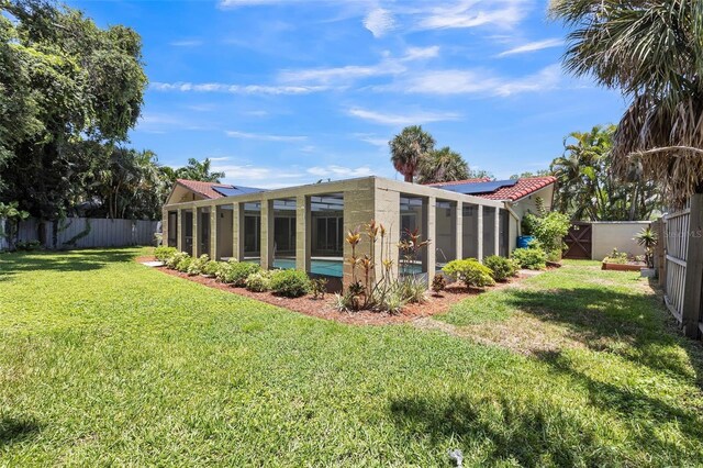 view of yard featuring a sunroom