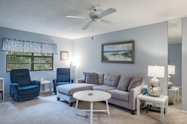 carpeted living room with a textured ceiling and ceiling fan