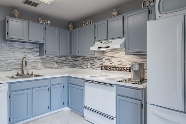 kitchen featuring white appliances, light tile patterned floors, backsplash, premium range hood, and sink