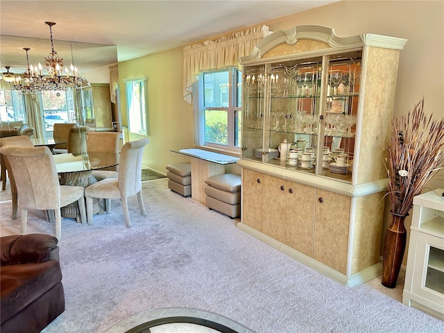 carpeted dining area with an inviting chandelier and a wealth of natural light