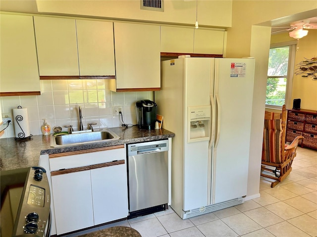 kitchen featuring sink, tasteful backsplash, white fridge with ice dispenser, light tile patterned flooring, and stainless steel dishwasher