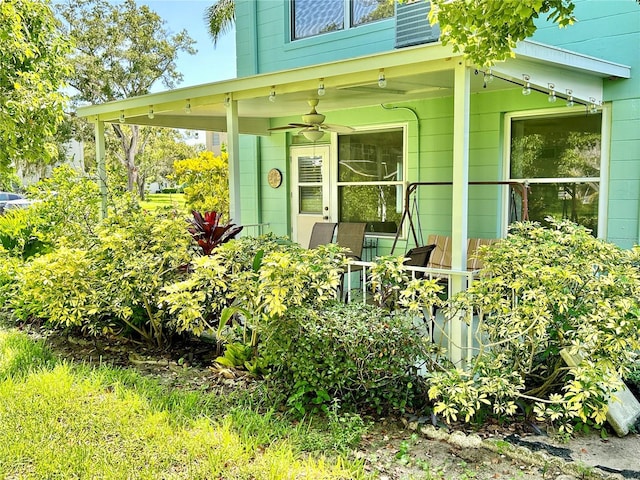 entrance to property with ceiling fan