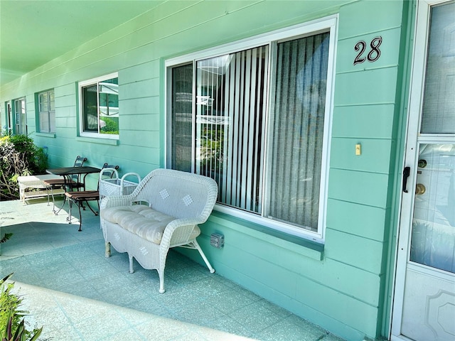 view of patio featuring a porch