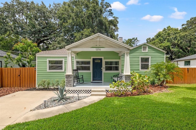 view of front of property with a front lawn and a porch