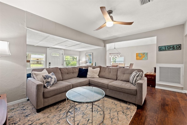 living room featuring wood-type flooring and ceiling fan