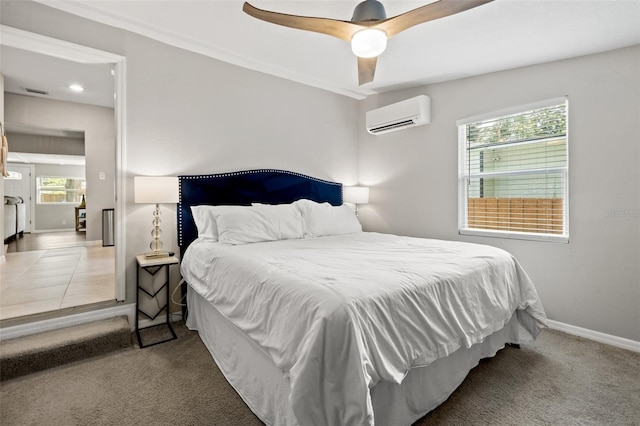 bedroom featuring ceiling fan, an AC wall unit, and carpet floors