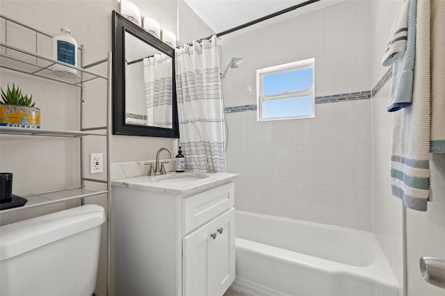 full bathroom with vanity, toilet, and shower / tub combo with curtain