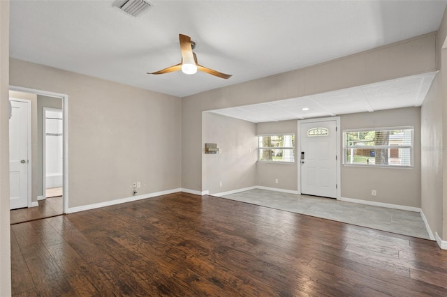 unfurnished living room featuring wood-type flooring and ceiling fan