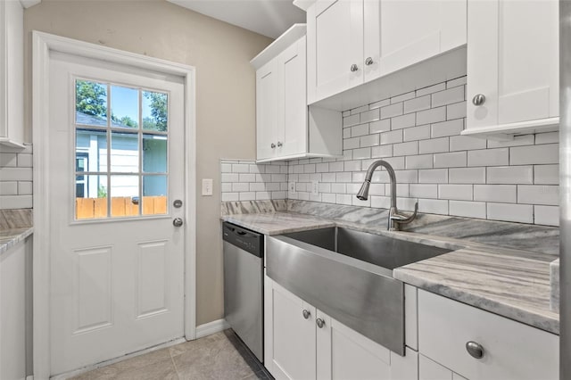 kitchen with stainless steel dishwasher, tasteful backsplash, white cabinetry, and light stone counters