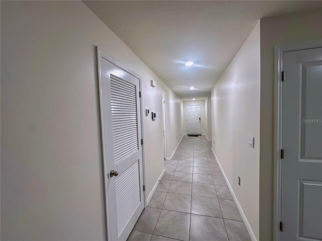 hallway with light tile patterned floors