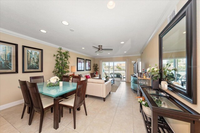 dining area featuring light tile patterned floors, ornamental molding, and ceiling fan