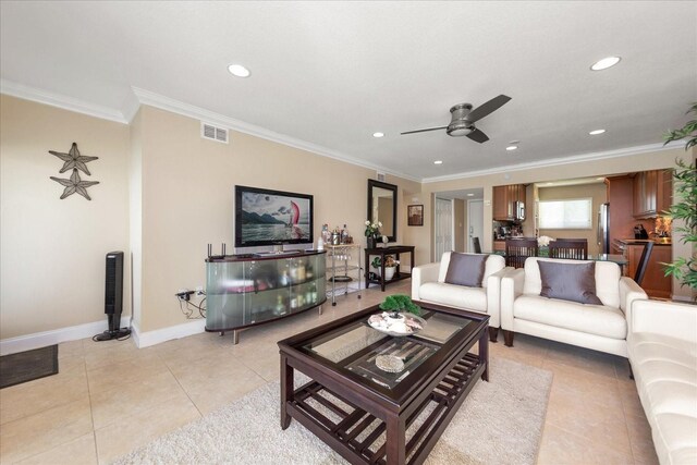 living room featuring ornamental molding, ceiling fan, and light tile patterned flooring